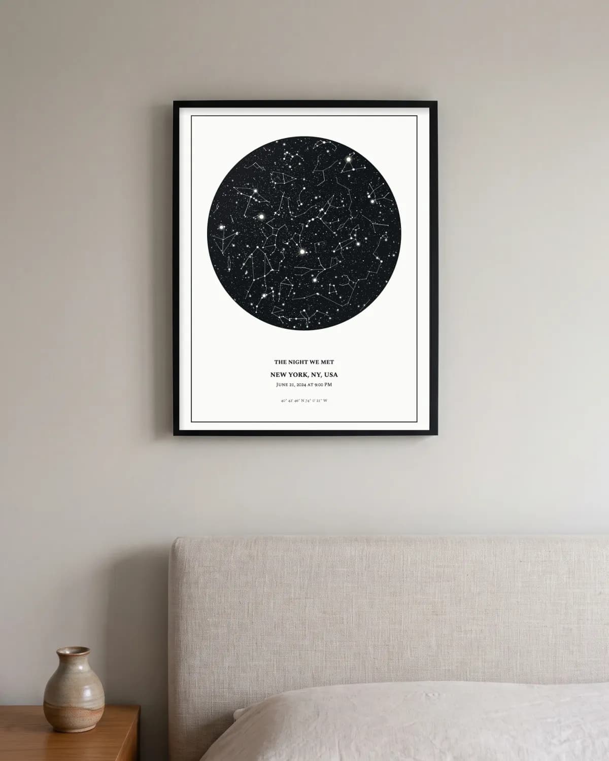 Classic, black frame star map poster on a wall